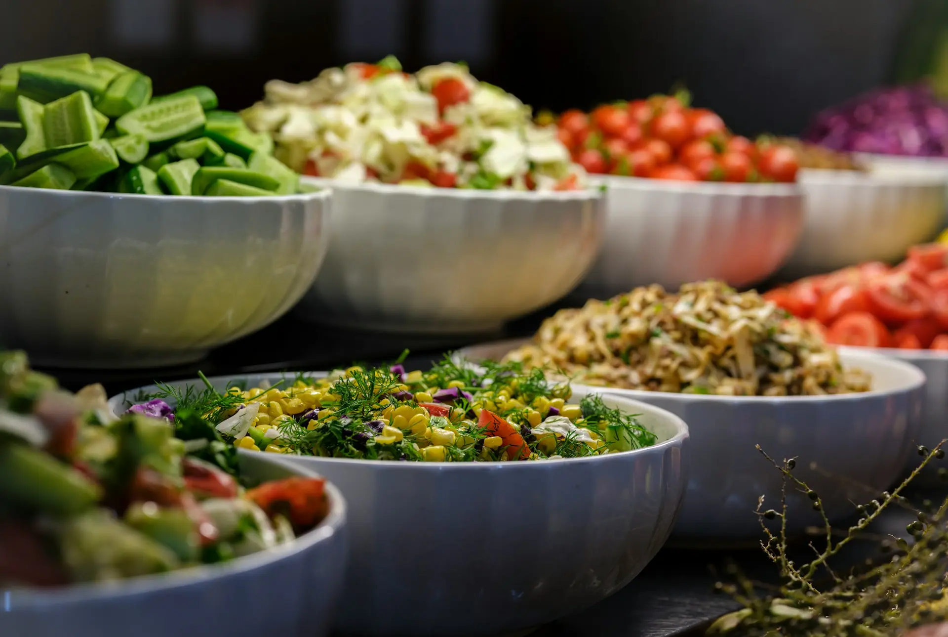 a group of bowls full of food